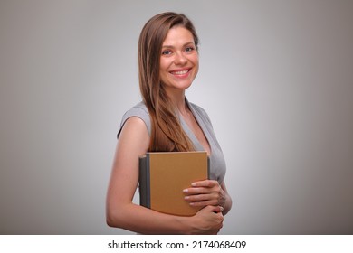 teacher or adult student book or workbook holding, Isolated business woman portrait, smiling female business person.