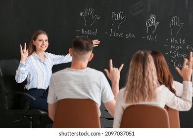 Teacher Conducting Courses For Deaf Mute People In Classroom