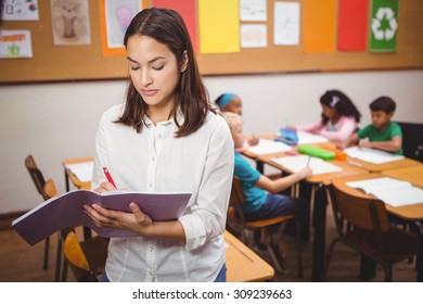 Teacher Correcting Some Class Work PPT template 63 | CrystalGraphics