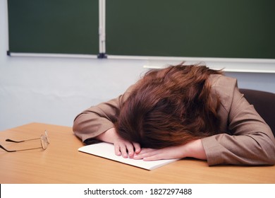 Teacher cry on a desk at school classroom. Overwork problem concept at work weekend - Shutterstock ID 1827297488