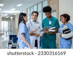 Teacher doctor man and group of medical student standing looking work in tablet. education and learning medical concept.