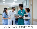 Teacher doctor man and group medical student standing looking work in tablet. education and learning medical concept. nurse students study from professional.