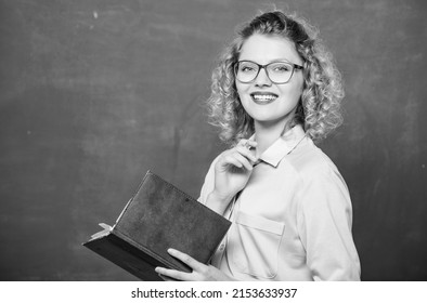 Teacher explain hard topic. Teacher best friend of learners. Pedagogue hold book and explaining information. Education concept. Woman school teacher in front of chalkboard. Passionate about knowledge
