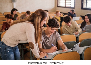 Teacher Explaining Individually To A Student In The University Class