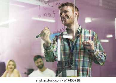 Teacher explaining the lesson to his students. School Concept.