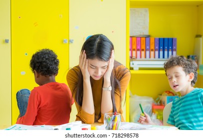 Teacher Get Headache With Two Naughty Kids In Classroom At Kindergarten School