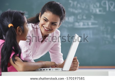 teacher and girl at laptop (horizontal)