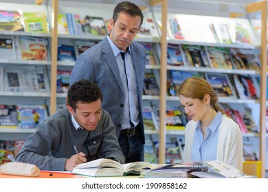 Teacher With Group Of Students Working