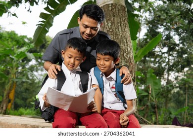 Teacher guiding two elementary students reading outdoors, education support and learning together, Elementary students studying with teacher outdoors