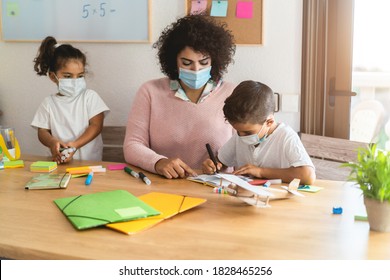 Teacher helping children in preschool during coronavirus outbreak - Focus on boy face