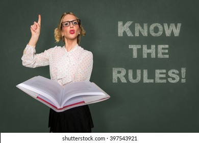 Teacher holds rule book know the rules message classroom lecture discipline motivational card - Shutterstock ID 397543921