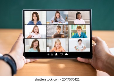 Teacher Hosting Online Class Using Video Conference On Tablet