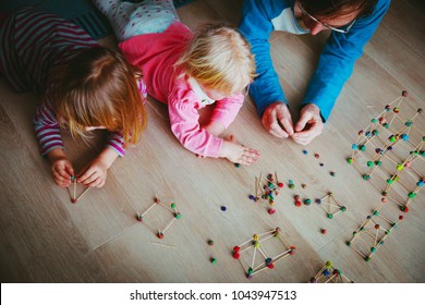 Teacher And Kids Making Geometric Shapes, Engineering And STEM Education