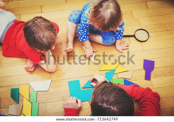 Teacher Kids Playing Geometric Shapes Stock Photo (Edit Now) 713642749