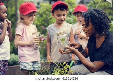 Teacher and kids school learning ecology gardening - Powered by Shutterstock