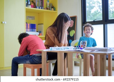 Teacher Kindergarten Hands Closed Face Of Her In An Upset Of Failed To Quell Quited Naughty, Of The Boys In Class At Preschool Kids Argument