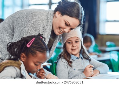 Teacher, learning and help children in class writing in notebook for education, studying or knowledge. Kids, happy woman and students in lesson for assistance or development at elementary school
