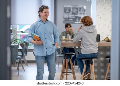 Teacher Leaving The School Cafeteria With A Happy Smile