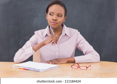 Teacher Looking Away While Thinking In A Class Room