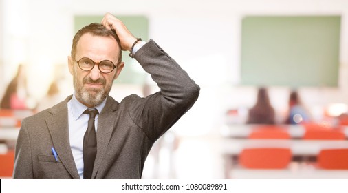 Teacher Man Using Glasses Doubt Expression, Confuse And Wonder Concept, Uncertain Future At Classroom