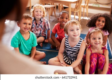 Teacher At Montessori School Reading To Children At Story Time - Shutterstock ID 641732941