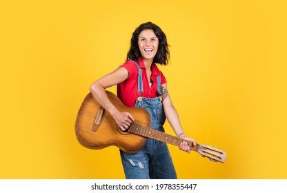 Teacher Of Music. Happy Beautiful Lady Playing The Guitar. Music And Vocal. Female Country Singer. Cheerful Woman Sing And Play. Girl With Acoustic Guitar Instrument. Feel Happiness And Joy