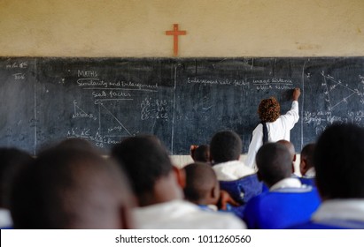 Teacher and pupils at mathematics lesson in a classroom in a school in Africa
