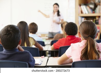 Teacher and schoolchildren in class - Shutterstock ID 200272673