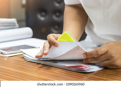 Teacher Is Searching For Homework Assignment Documents Of Student On The Teacher's Desk. Paperwork Pile Print Document Organized Put On The Table.
