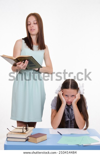 Teacher Standing Desk Behind Which Sits Royalty Free Stock Image