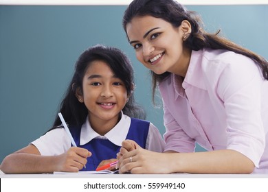 Teacher And Student Smile At Camera (horizontal)