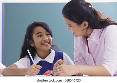 Teacher And Student Smile At Each Other