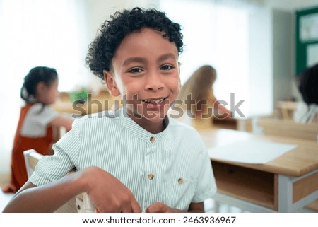 Teacher and students, Learn and study in a classroom of school where youngsters sit and listen attentively.