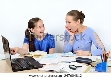 Teacher is surprised by result of work schoolgirl on a computer