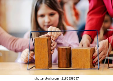 A Teacher Teaching Children Shapes On Geometry Class, Selective Focus On Objects.