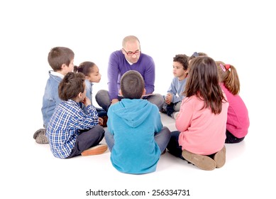 Teacher Telling A Story To Kids Isolated In White