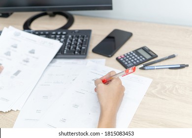 Teacher Use A Red Pen Check Example Sheet And Examination  Equipment On The Wood Table And Use Desktop Computer Working 