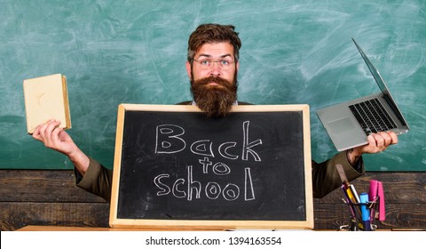 Teacher Welcomes New Pupils Enter Educational Institution. Come To Us. Private School Advertising To Boost Enrollments. Teacher Or School Principal Welcomes With Blackboard Inscription Back To School.