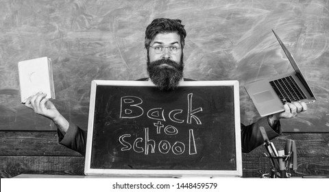 Teacher Welcomes New Pupils Enter Educational Institution. Come To Us. Private School Advertising To Boost Enrollments. Teacher Or School Principal Welcomes With Blackboard Inscription Back To School.