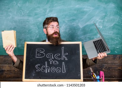 Teacher Welcomes Pupils Study Traditional And Modern Subjects. Private School Advertising Boost Enrollments. Study With Us. Teacher Or School Principal Welcomes Blackboard Inscription Back To School.