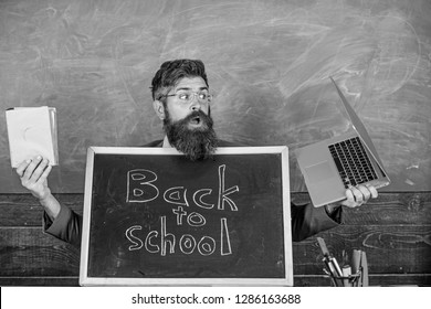 Teacher Welcomes Pupils Study Traditional And Modern Subjects. Private School Advertising Boost Enrollments. Study With Us. Teacher Or School Principal Welcomes Blackboard Inscription Back To School.