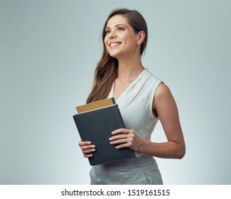 Teacher Woman With Long Hair Holding Books Looking Away. Isolated Female Portrait.