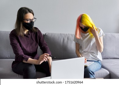 Teacher Working With College Student Individually, Woman And Teenage Girl In Black Protective Masks. Virus Prevention, Health Protection, Education Concept