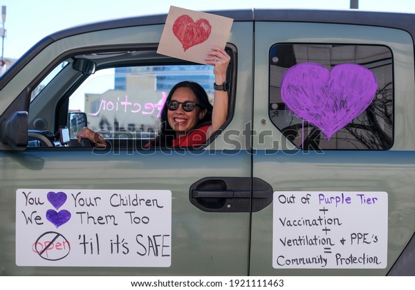 Teachers\
take part in a car caravan to demand for stronger COVID-19 safety\
measures and an end to ``\