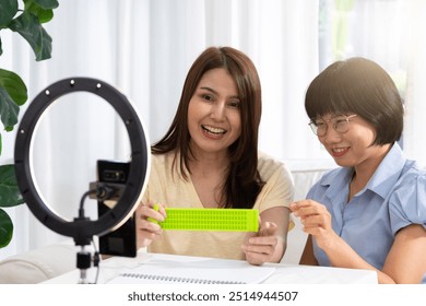 Teaching Braille to visually impaired individuals, the instructor patiently guides them through each tactile symbol, empowering them with a new way to read and communicate. - Powered by Shutterstock