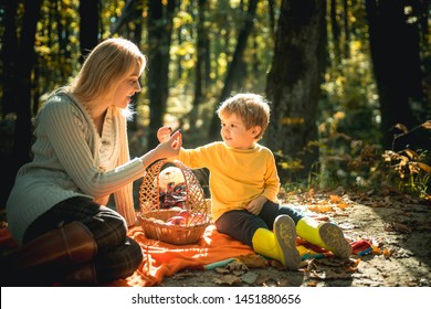 Teaching Son Healthy Nutrition. Having Snack Picnic Hike. Happy Childhood. Mom And Kid Boy Relaxing While Hiking Forest. Family Picnic. 