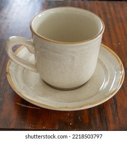 Teacup On Saucer Plate On Wooden Side Table