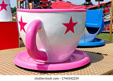 Teacup Ride At Fair. Close Up Of Large Pink And White Teacup.