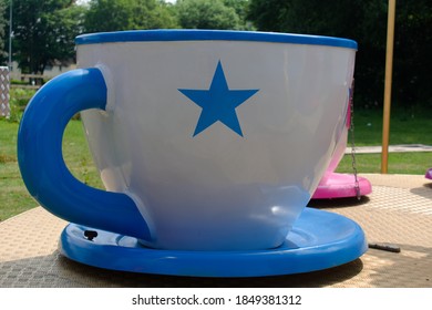 Teacup Ride At Fair. Close Up Of Large Blue And White Teacup.