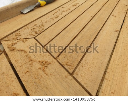 Teak deck construction with using wood chisel